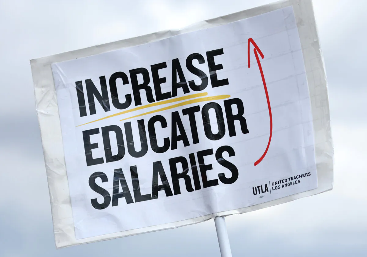 A sign reads 'Increase Educator Salaries' as Los Angeles Unified School District workers and supporters rally in Los Angeles State Historic Park, on March 23, 2023. (Mario Tama/Getty Images)