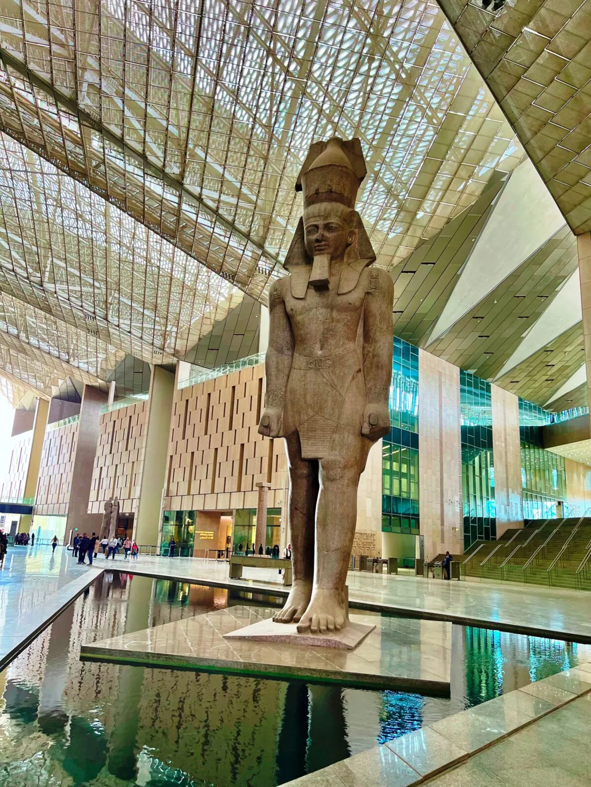 This 70-foot-high granite statue of Ramses II welcomes visitors to the new Grand Egyptian Museum, which was undergoing a soft opening in March. (Marla Jo Fisher/Orange County Register/TNS)