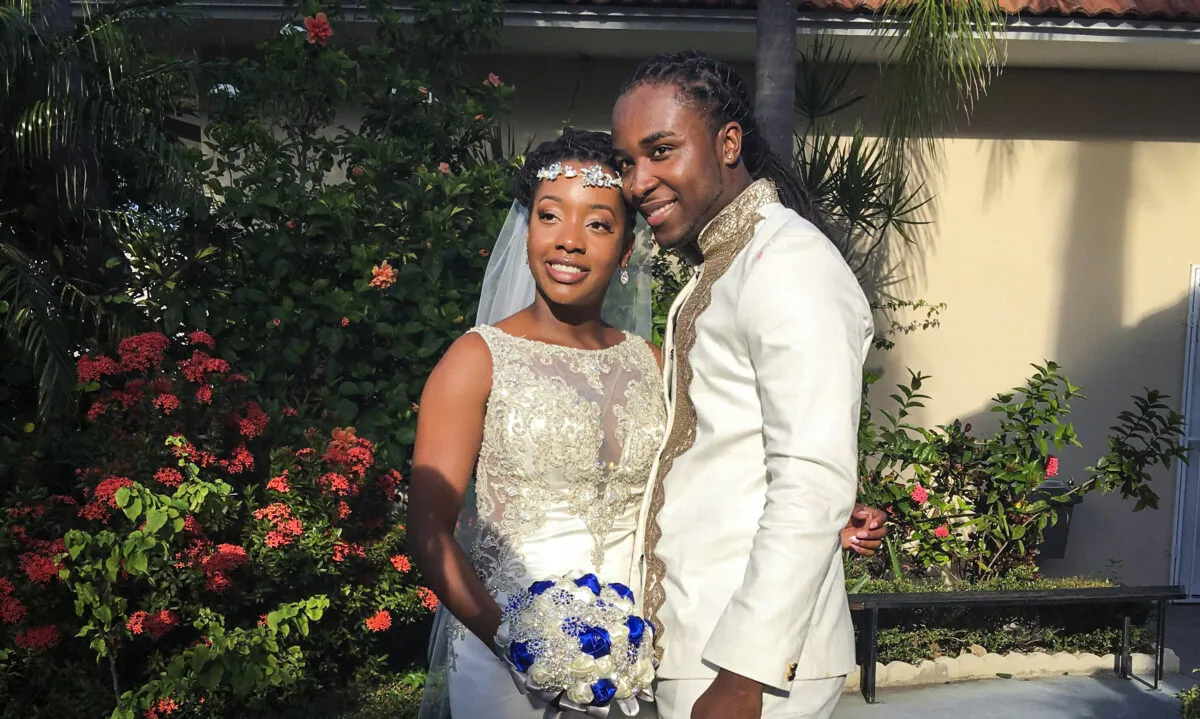 Jean-Dickens Toussaint and his wife Abigail Michael Toussaint pose for a photo at their wedding in Pompano Beach, Fla., on Nov. 9, 2018. (Nikese Toussaint via AP)