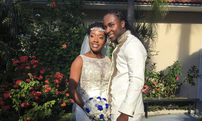 Jean-Dickens Toussaint and his wife Abigail Michael Toussaint pose for a photo at their wedding in Pompano Beach, Fla., on Nov. 9, 2018. (Nikese Toussaint via AP)