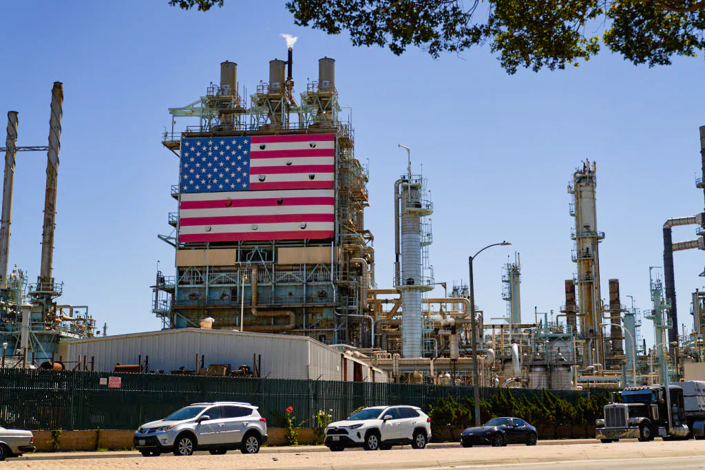 An oil refinery displays an American flag in Wilmington, Calif., on Sept. 21, 2022. (Allison Dinner/Getty Images)