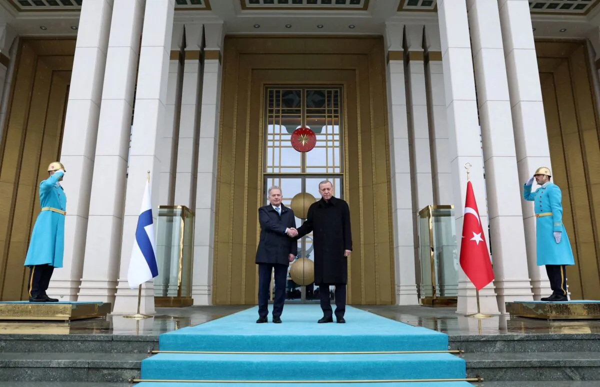 Turkey's President Tayyip Erdogan and Finland’s President Sauli Niinisto shake hands during a welcoming ceremony in Ankara, Turkey, on March 17, 2023. (Murat Cetinmuhurdar/Presidential Press Office/Handout via Reuters)