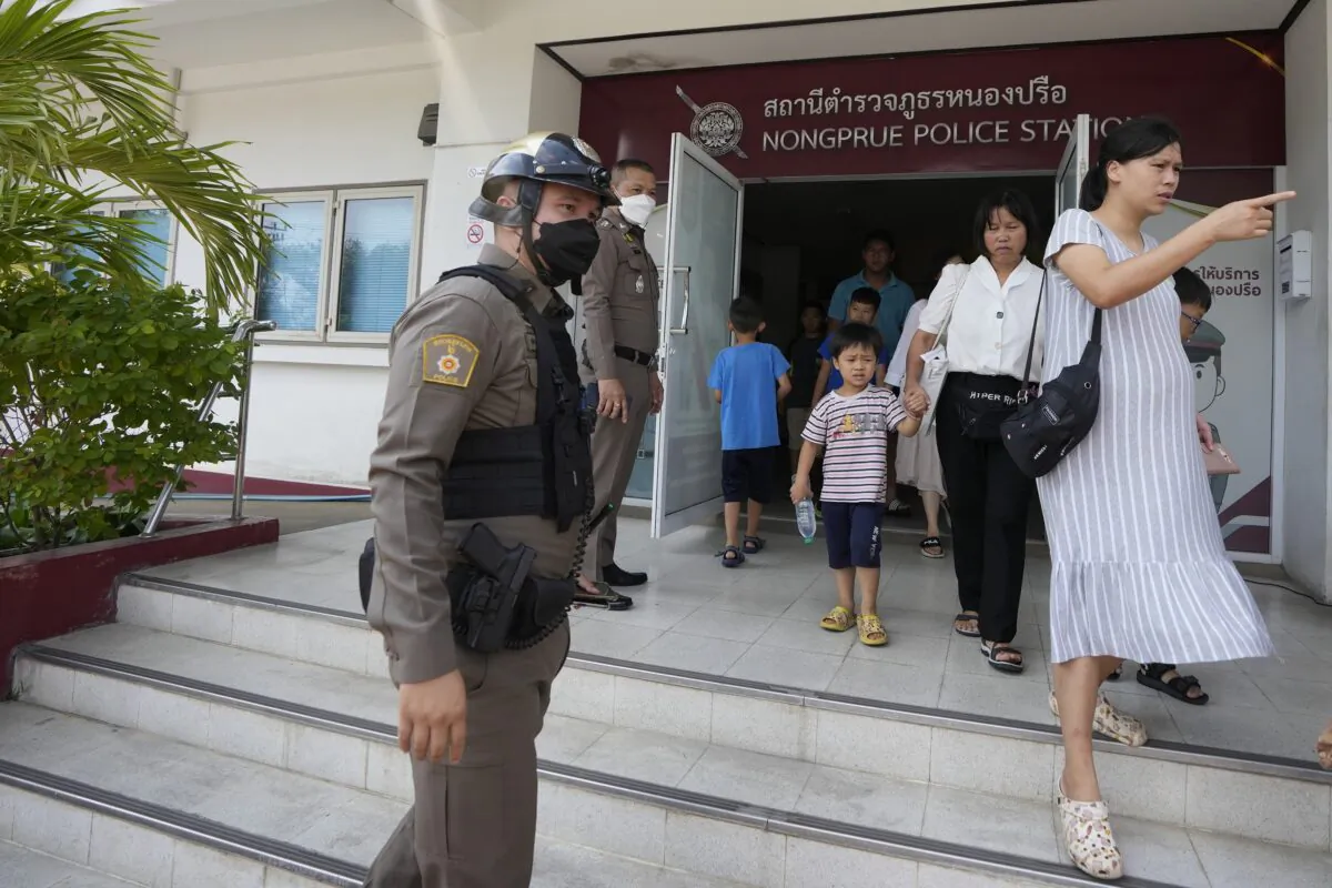 Members of the Shenzhen Holy Reformed Church, also known as the Mayflower Church, leave from the Nongprue police station on their way to Pattaya Provincial Court in Pattaya, Thailand, on March 31, 2023. (Sakchai Lalit/AP Photo)