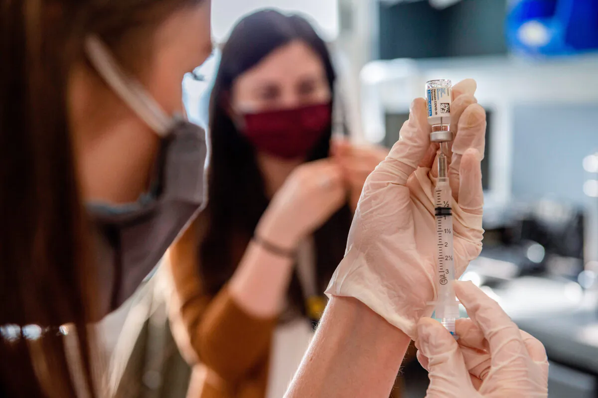 A COVID-19 vaccine is prepared in Boston, Mass., on March 4, 2021. (Joseph Prezioso/AFP via Getty Images)