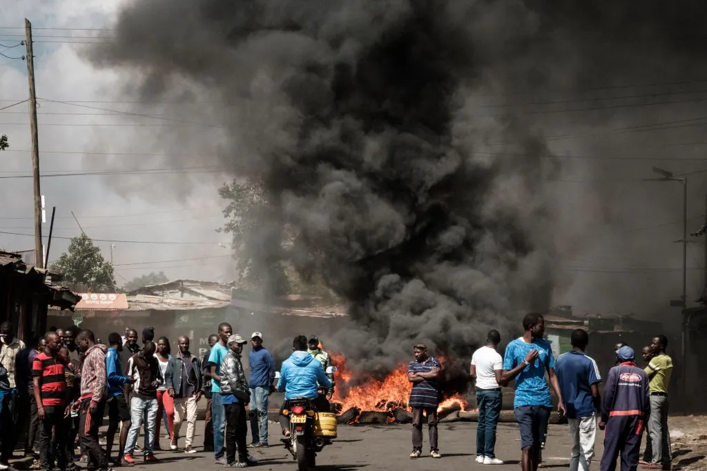 Protesters gather at a burning barricade during a protest called by the opposiion coalition "Azimio la Umoja," in Kibera, Nairobi, on March 30, 2023.
YASUYOSHI CHIBA/AFP via Getty Images
