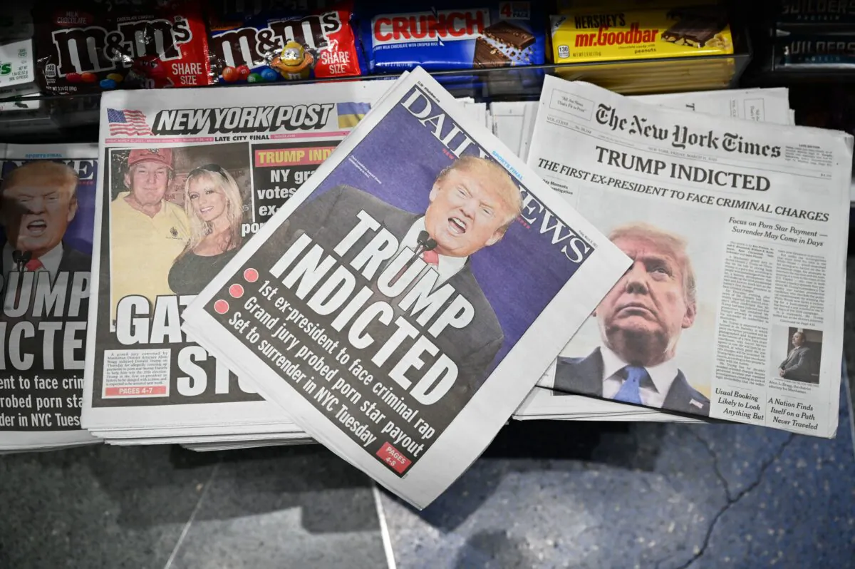 Newspaper front pages with former U.S. President Donald Trump are displayed at a news stand in New York on March 31, 2023. (Ed Jones/AFP via Getty Images)