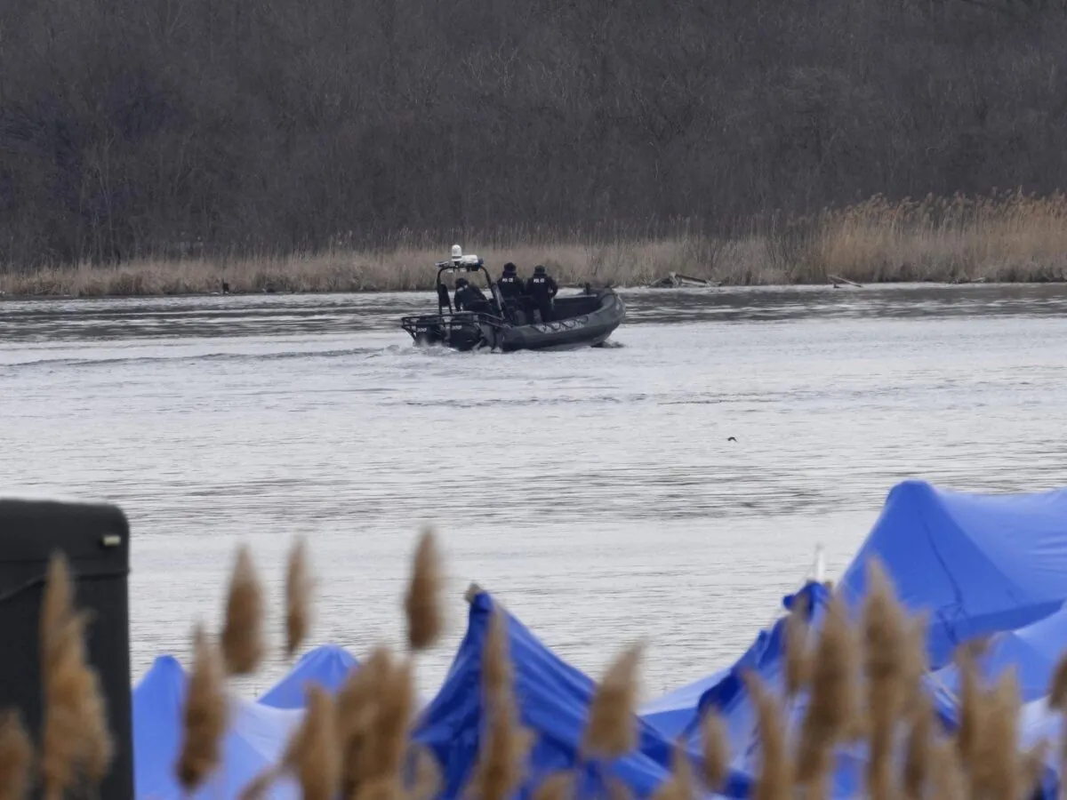 A police boat searches the area in Akwesasne, Que., Mar. 31, 2023. (The Canadian Press/Ryan Remiorz)
