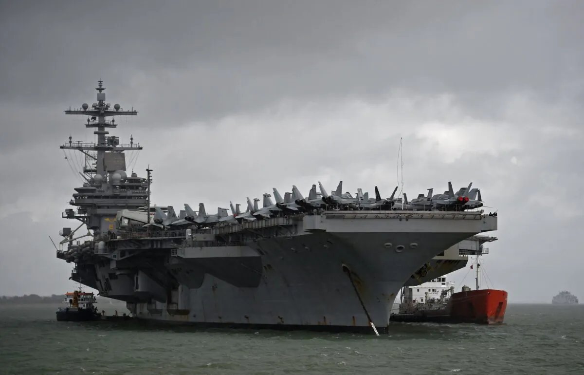 The USS George H.W. Bush aircraft carrier anchored off Stokes Bay in the Solent, Britain, on July 27, 2017. (Hannah McKay/Reuters)