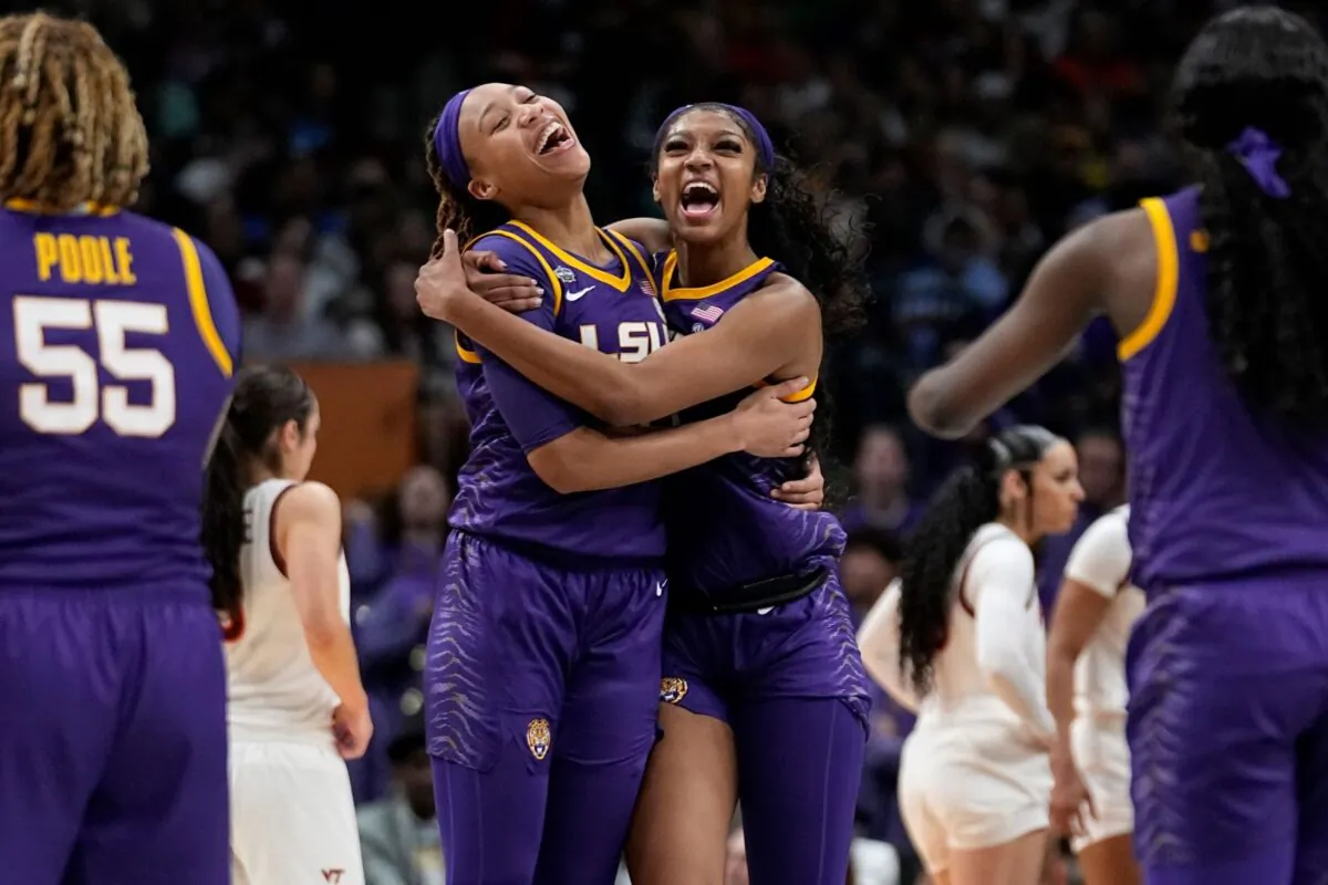 LSU's Angel Reese and LaDazhia Williams react during the second half of an NCAA Women's Final Four semifinals basketball game against Virginia Tech in Dallas, on March 31, 2023. (Tony Gutierrez/AP Photo)