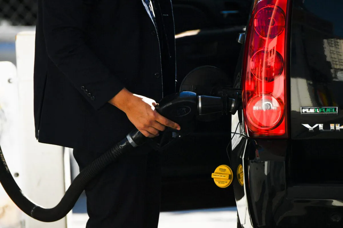 A customer pumps gasoline into an sport utility vehicle (SUV) at a Shell gas station in Los Angeles, Calif., on Feb. 17, 2022. (Patrick T. Fallon/AFP via Getty Images)
