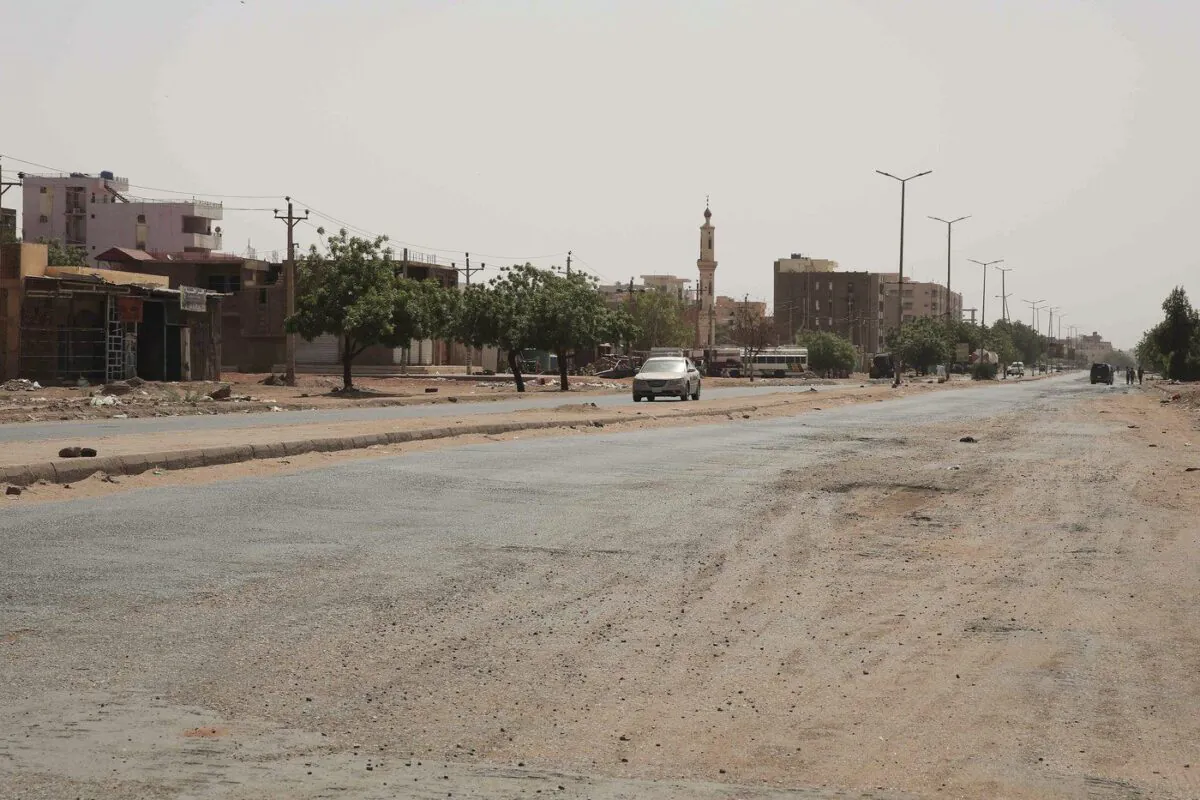 A vehicle crosses an empty street in Khartoum, Sudan, on April 29, 2023, as gunfire and heavy artillery fire continued despite the extension of a cease-fire between the country's two top generals. (The Canadian Press/AP-Marwan Ali)
