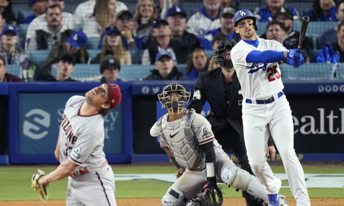 Los Angeles Dodgers' Trayce Thompson, right, hits a three-run home run as Arizona Diamondbacks relief pitcher Kevin Ginkel, left, watches along with catcher Gabriel Moreno, second from left, and home plate umpire John Tumpane during the fifth inning of a baseball game in Los Angeles on April 1, 2023. (Mark J. Terrill/AP Photo)