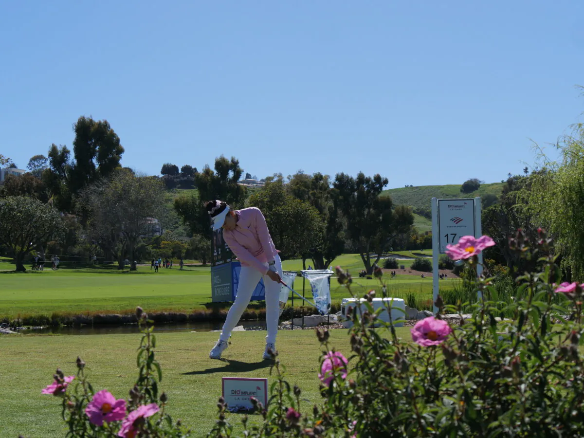 Lucy Li of the United States hits her tee shot on the par-3 17th hole at the DIO Implant LA Open at Palos Verdes Golf Club, in Palos Verdes Estates, Calif., on April 1, 2023. (Nhat Hoang/The Epoch Times)