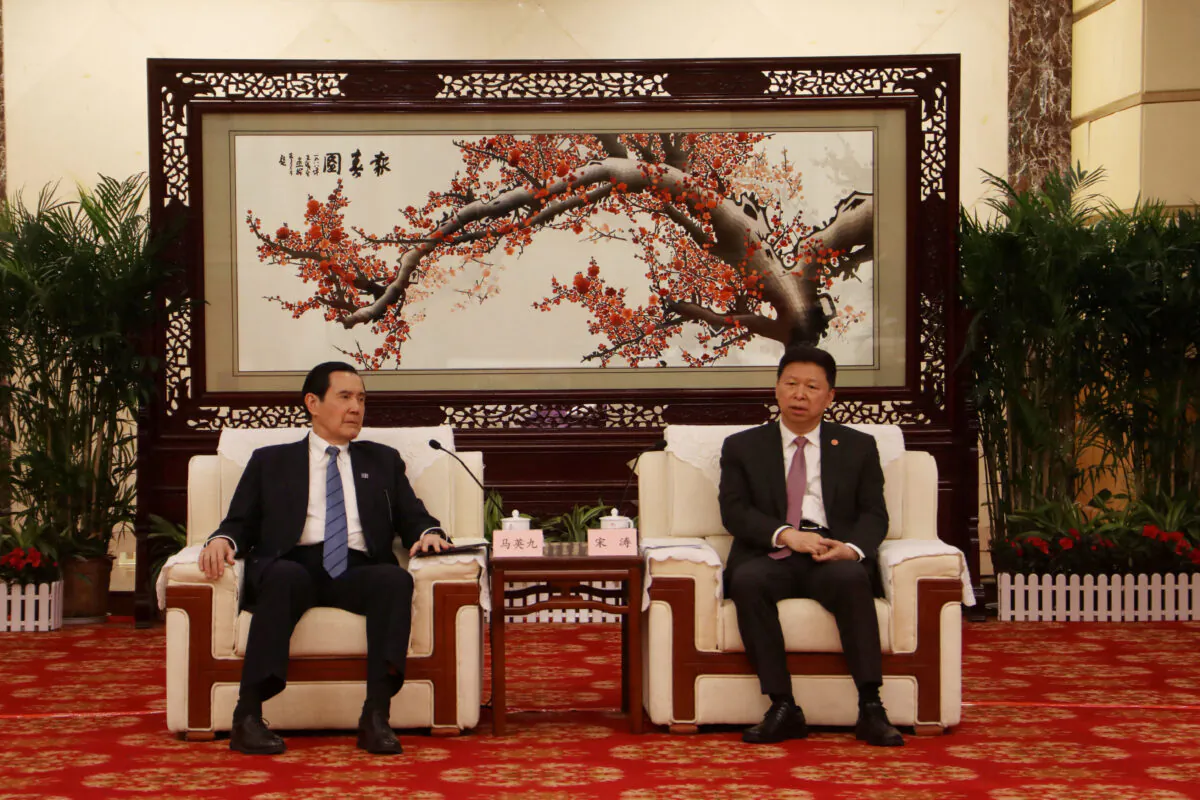 Former Taiwanese president Ma Ying-jeou (L) meets the head of China's Taiwan Affairs Office of the State Council Song Tao, in Wuhan, Hubei province, China in handout picture released March 30, 2023. (Ma Ying-jeou's Office/Handout via Reuters)