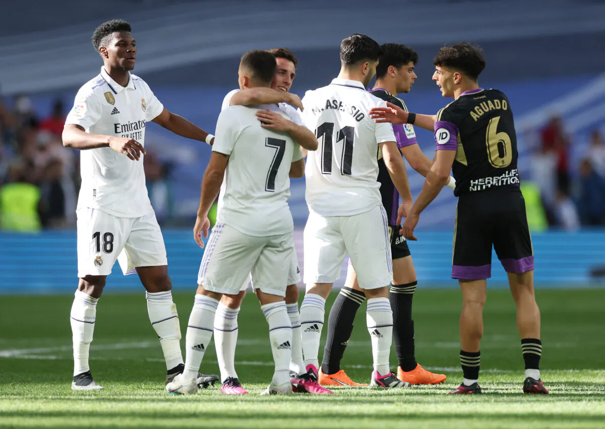 Real Madrid players celebrate after the LaLiga Santander match between Real Madrid CF and Real Valladolid CF at Estadio Santiago Bernabeu in Madrid on April 2, 2023. (Isabel Infantes/Reuters)