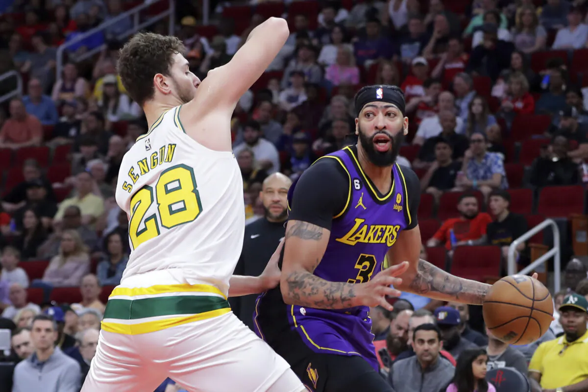 Los Angeles Lakers forward Anthony Davis, right, drives around Houston Rockets center Alperen Sengun (28) during the first half of an NBA basketball game in Houston on April 2, 2023. (Michael Wyke/AP Photo)