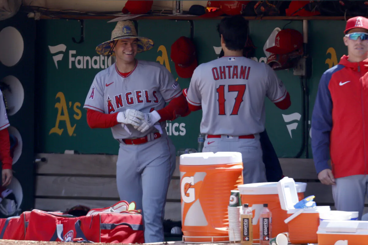 Los Angeles Angels' Logan O'Hoppe, left, is congratulated by teammate Shohei Ohtani (17) after hitting a thee-run home run during the fourth inning of a baseball game against the Oakland Athletics in Oakland, Calif., on April 2, 2023. (Jed Jacobsohn/AP Photo)