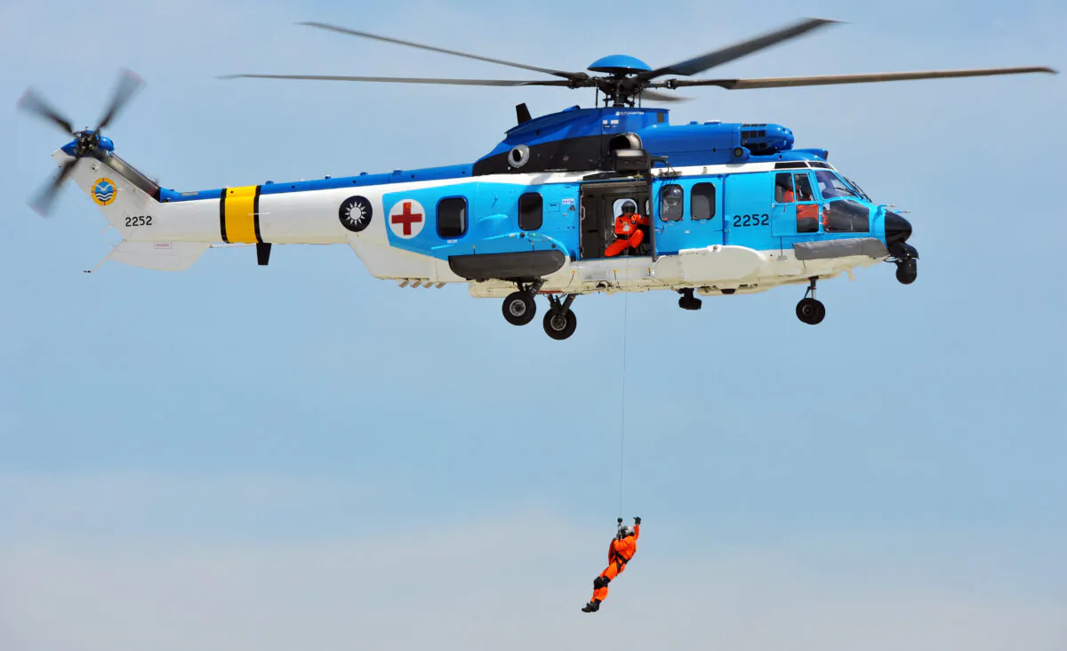 Personnel on board a rescue helicopter EC-225 put on a demonstration during a ceremony in Taipei on July 10, 2012. (Mandy Cheng/AFP/GettyImages)