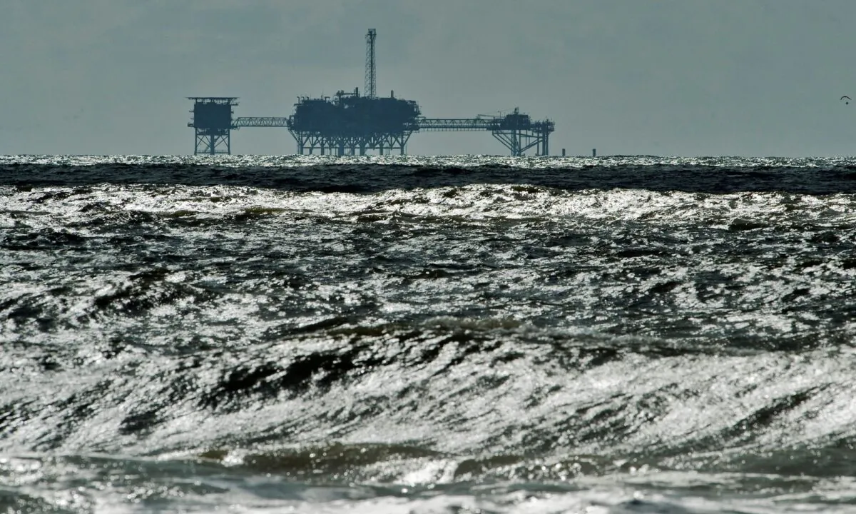 An oil and gas drilling platform stands offshore near Dauphin Island, Ala., in the Gulf of Mexico. (Steve Nesius/Reuters)