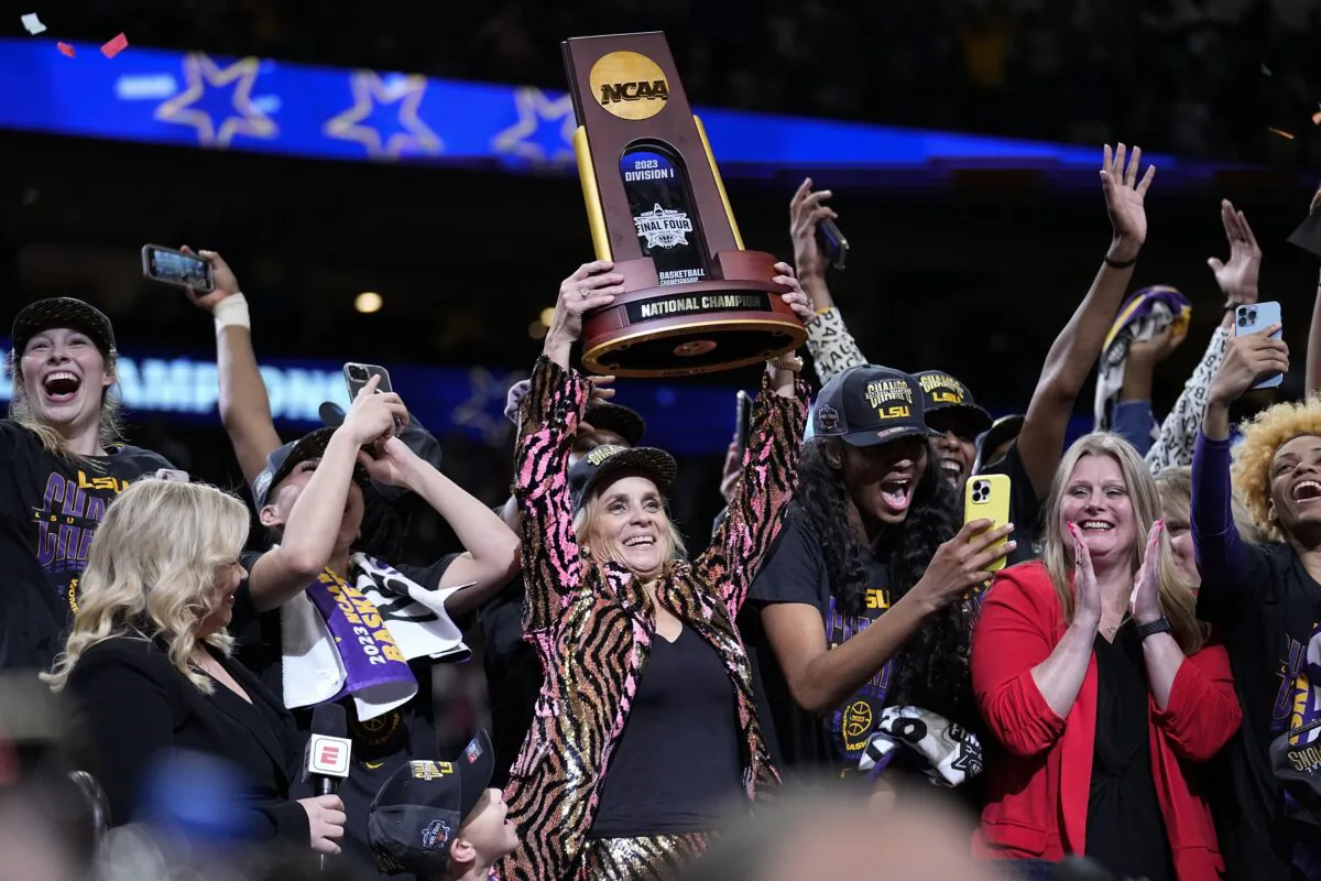 LSU head coach Kim Mulkey holds the winning trophy after the NCAA Women's Final Four championship basketball game against Iowa in Dallas on April 2, 2023. (Tony Gutierrez/AP Photo)