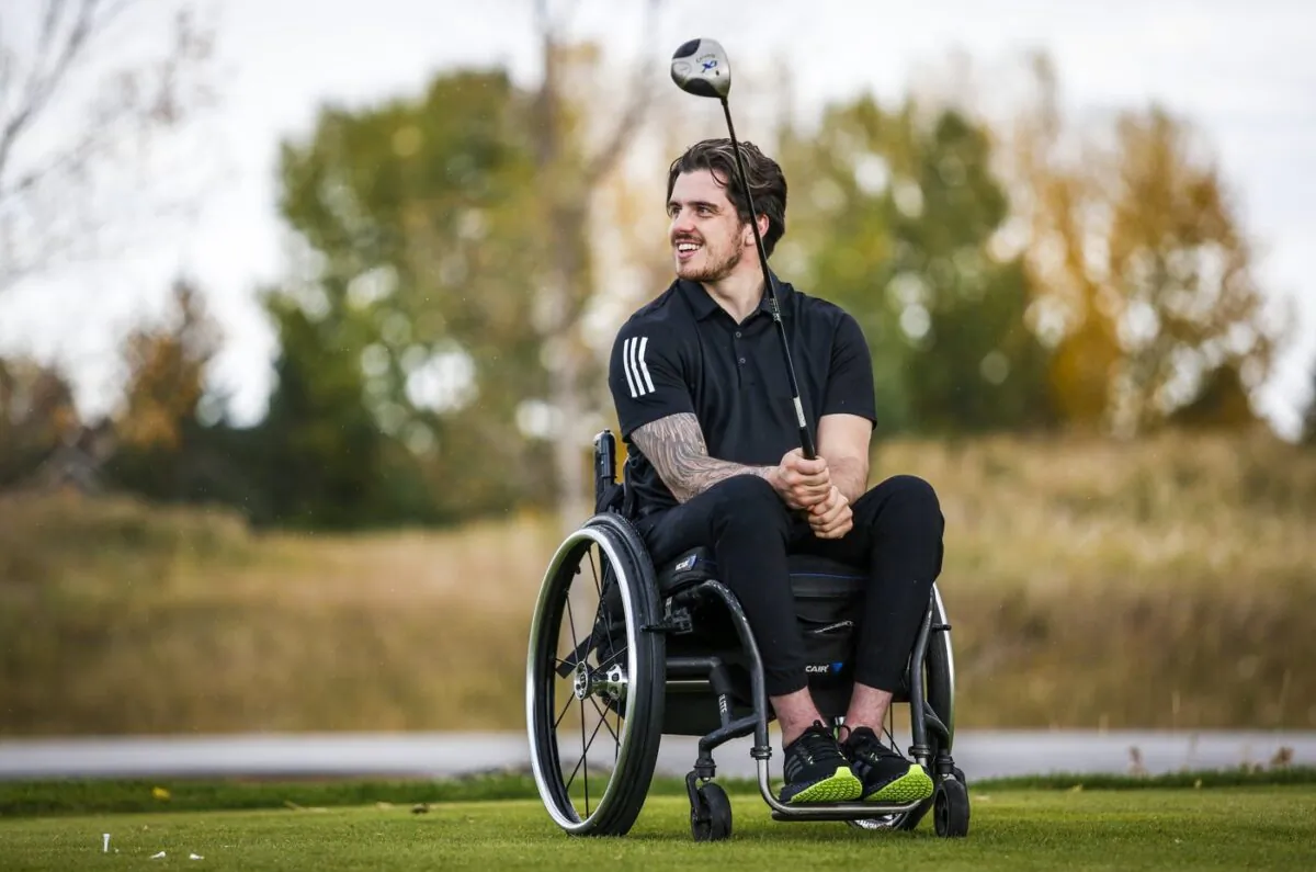 Humboldt Broncos bus crash survivor Ryan Straschnitzki pauses during a para golf lesson in Calgary on Sept. 28, 2021. (The Canadian Press/Jeff McIntosh)