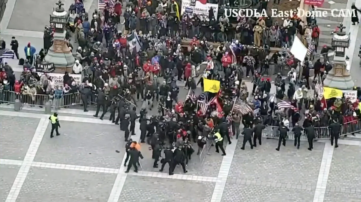 A Capitol Police security camera captures the breach of barricades on the Capitol's east side on Jan. 6, 2021. (U.S. Department of Justice/Screenshot via The Epoch Times)