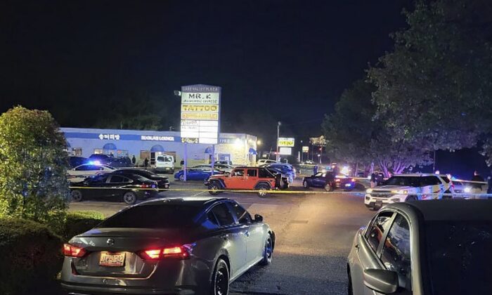 Police is working on the scene of a shooting near the V Luxx Hookah Lounge in Fayetteville, N.C., on April 3, 2023. (Fayetteville Police Department via AP)