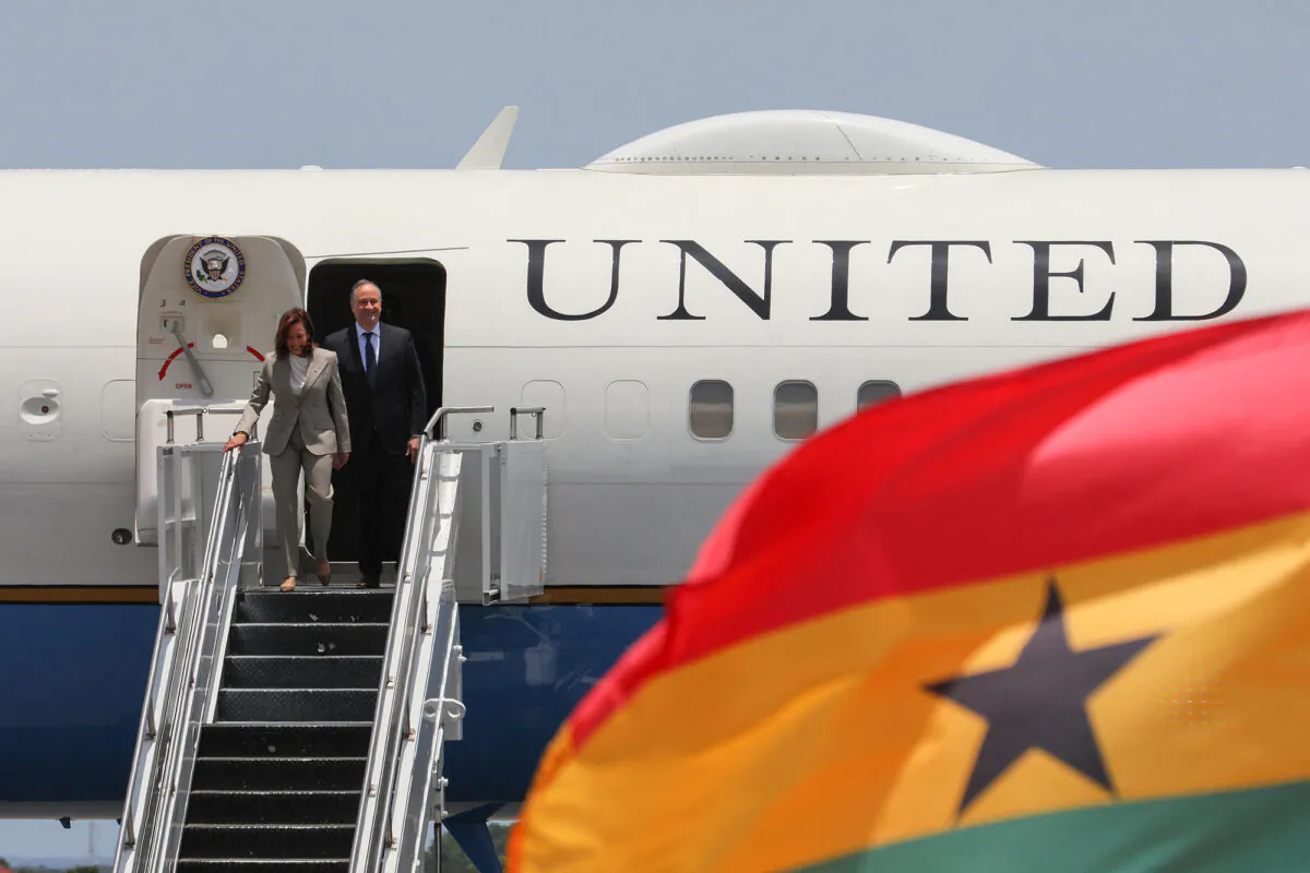 U.S. Vice President Kamala Harris (L) and Second Gentleman of the United States Douglas Emhoff (R) disembark the plane as they arrive at the Kotoka International Airport in Accra, Ghana, on March 26, 2023. (Nipah Dennis/AFP via Getty Images)
