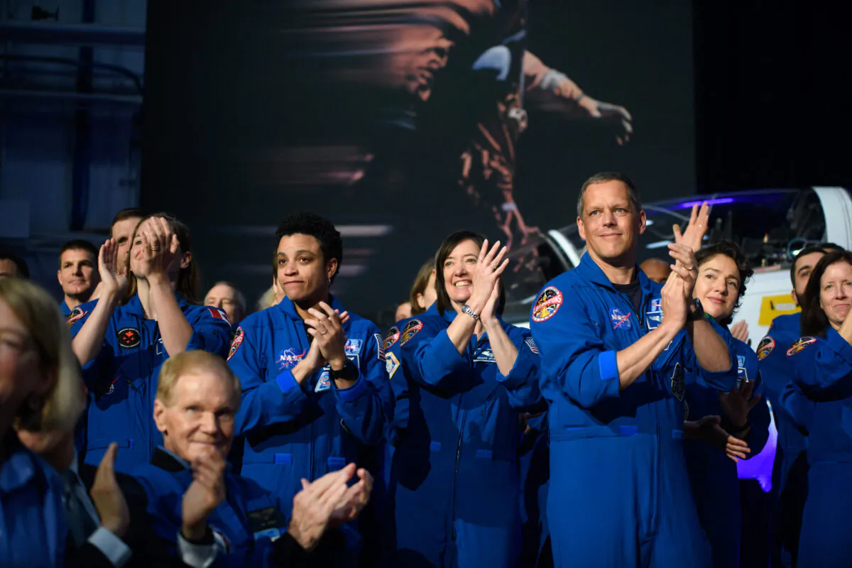 NASA astronauts listen to speakers during the Artemis II crew announcement held by NASA and CSA at Ellington airport in Houston, Texas, on April 3, 2023. (Mark Felix/AFP via Getty Images)