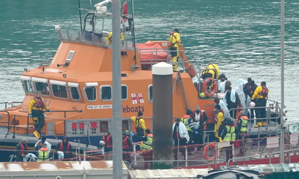 A group of people thought to be illegal immigrants are brought in to Dover, Kent, on March 29, 2023. (Gareth Fuller/PA Media)

