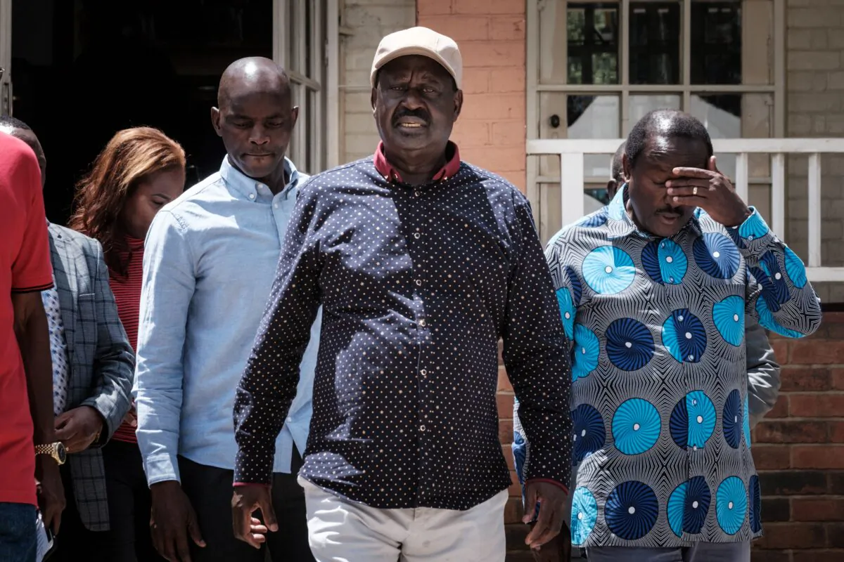 Raila Odinga (2nd R), the leader of the Kenyan opposition coalition Azimio la Umoja, walks to attend their presser condemning the brutality of police during their rally at the Jaramogi Oginga Odinga Foundation in Nairobi on March 28, 2023. Police fired tear gas to disperse anti-government protests on March 27, 2023, over the high cost of living, after the opposition vowed demonstrations would go ahead despite a police ban. (YASUYOSHI CHIBA/AFP via Getty Images)