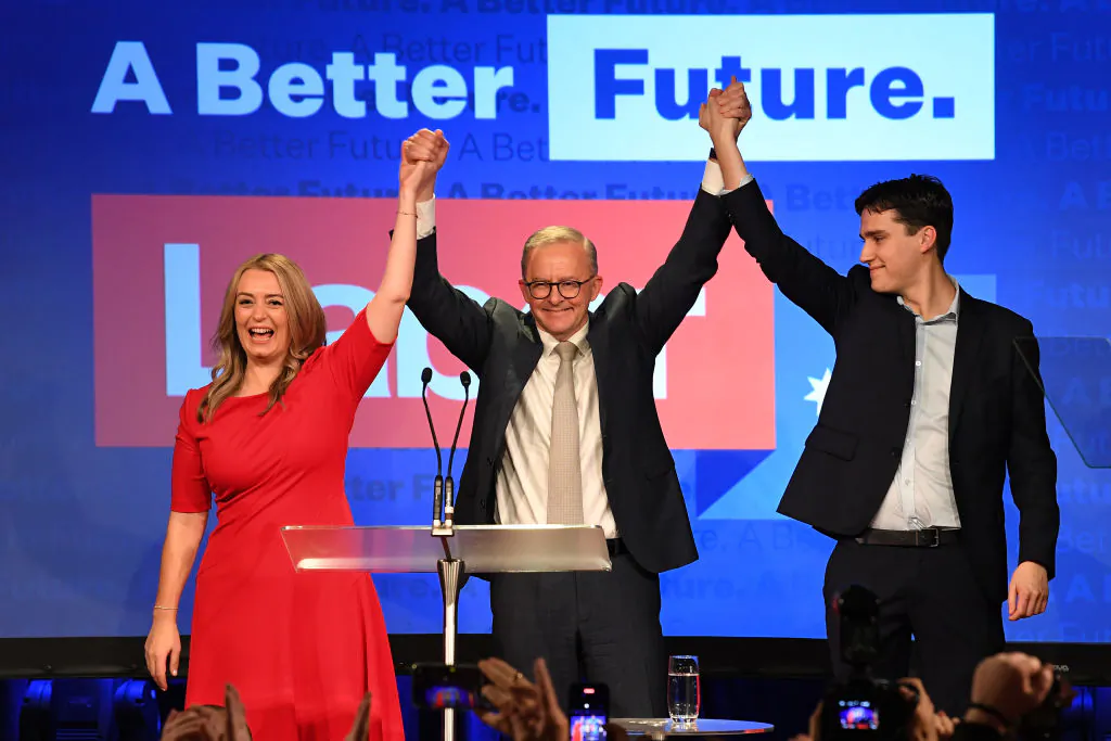 Prime Minister Anthony Albanese, his partner Jodie Haydon and his son Nathan Albanese celebrate victory during the Labor Party election night event at Canterbury-Hurlstone Park RSL Club in Sydney, Australia, on May 21, 2022. (James D. Morgan/Getty Images)
