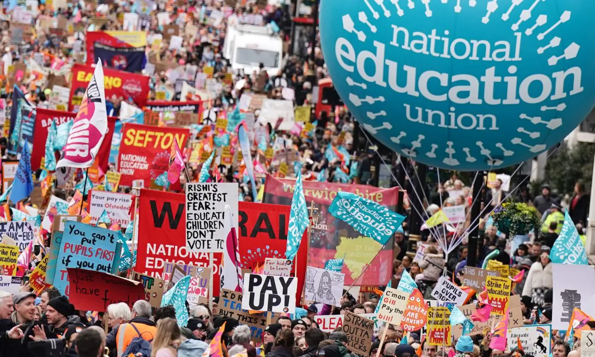 Striking members of the National Education Union (NEU) on Piccadilly march to a rally in Trafalgar Square, central London, on March 15, 2023. (Aaron Chown/PA Media)
