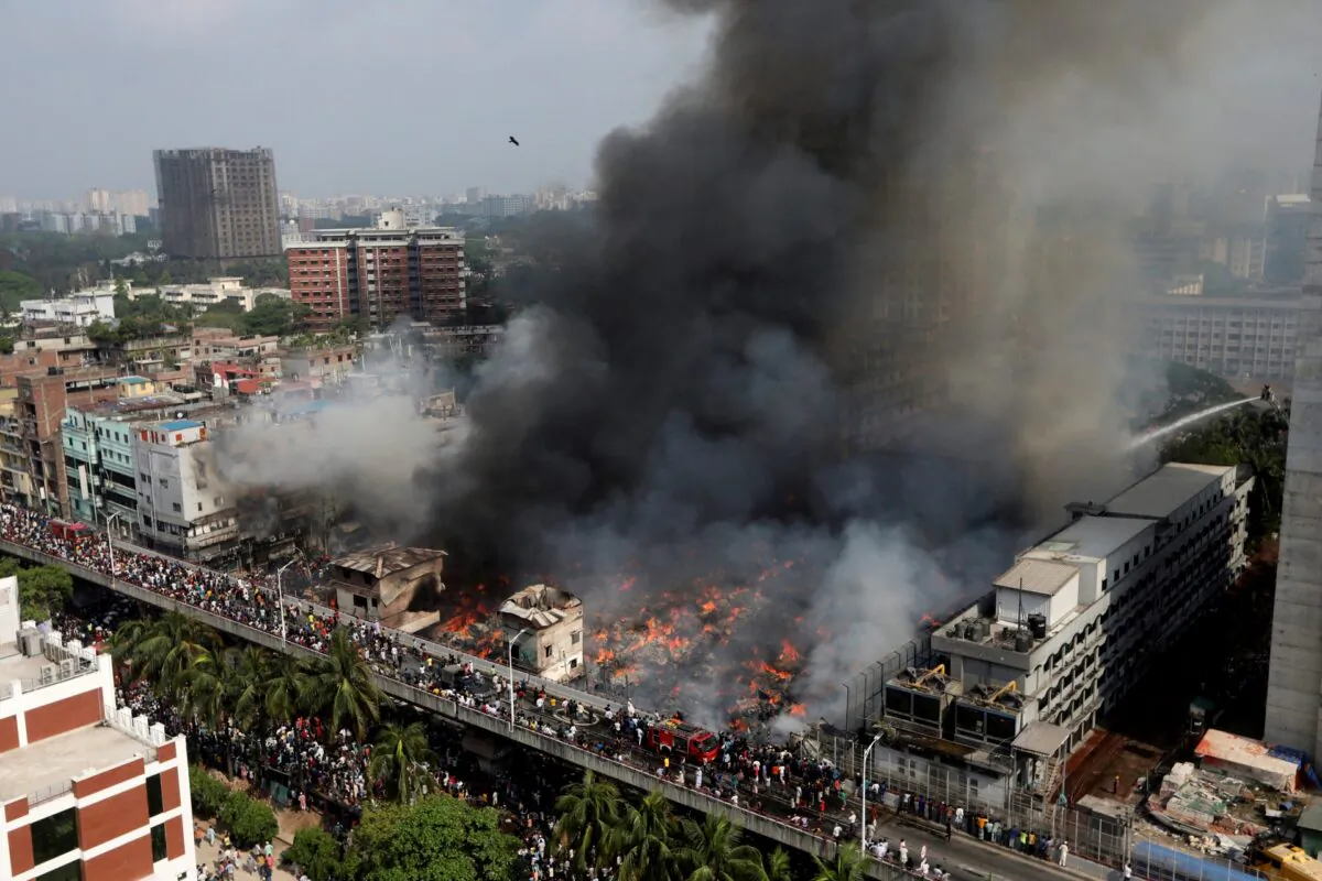 A fire rages at a popular market for cheaper clothes in Bangladesh's capital Dhaka, Bangladesh, on April, 4, 2023. (Mahmud Hossain Opu/AP)
