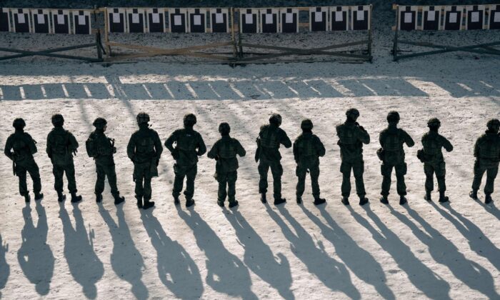 Finnish reservists of the Guard Jaeger Regiment stand at a shooting range as they take part in a military exercise at the Santahamina military base in Helsinki, Finland on March 7, 2023. (Alessandro Rampazzo/AFP via Getty Images)