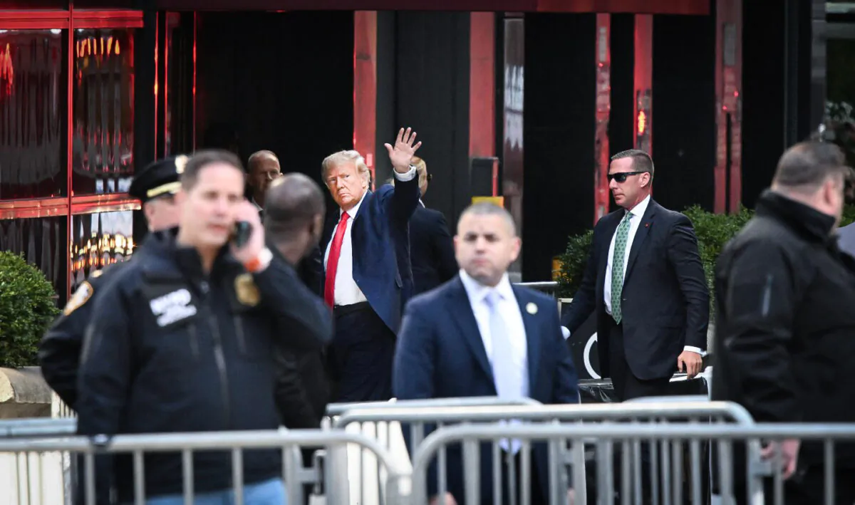 Former President Donald Trump waves as he arrives at Trump Tower in New York on April 3, 2023. (Ed Jones/AFP via Getty Images)