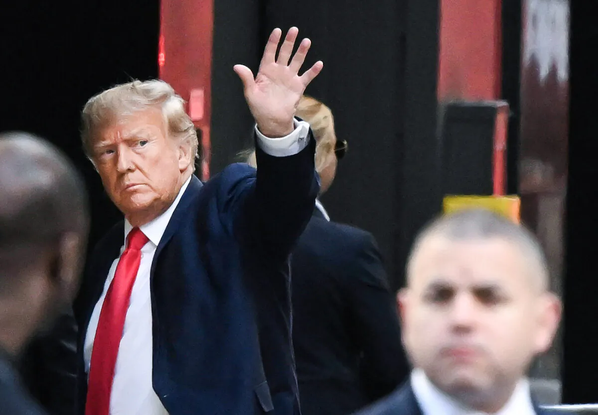 Former President Donald Trump waves as he arrives at Trump Tower in New York City, N.Y., on April 3, 2023. (Ed Jones/AFP via Getty Images)