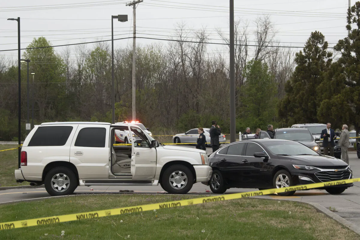 Knox County Sheriff's Office and FBI officers work in a parking lot area following a manhunt for Roy McGrath, in Knoxville, Tenn., on April 3, 2023. (Saul Young/Knoxville News Sentinel via AP)