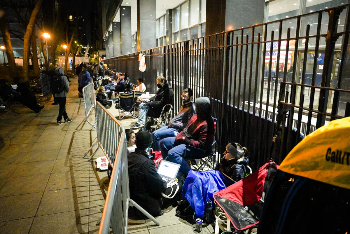 Reporters gather outside the New York County Criminal Court in the early morning ahead of former President Donald Trump's arraignment on April 4, 2023. (Samira Bouaou/The Epoch Times)