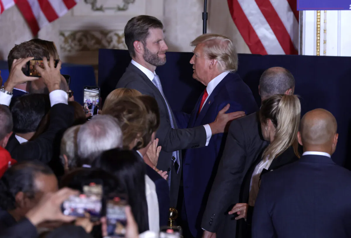 Former President Donald Trump (R) talks with son Eric Trump (L) during an event at Mar-a-Lago in West Palm Beach, Florida, on April 4, 2023. (Alex Wong/Getty Images)
