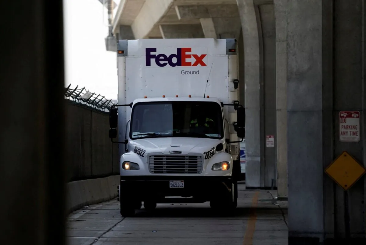 A FedEx Ground truck drives near a FedEx regional hub at Los Angeles International Airport (LAX) on Sept. 16, 2022. (Bing Guan/Reuters)