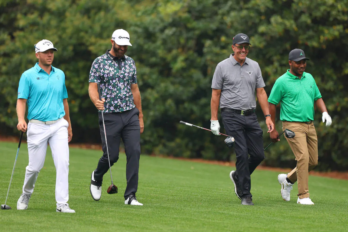LIV Golf members Talor Gooch, Dustin Johnson, Phil Mickelson, and Harold Varner III (all of the United States), walk down the 11th fairway during a practice round prior to the 2023 Masters Tournament at Augusta National Golf Club in Augusta, Georgia, on April 4, 2023. (Andrew Redington/Getty Images)