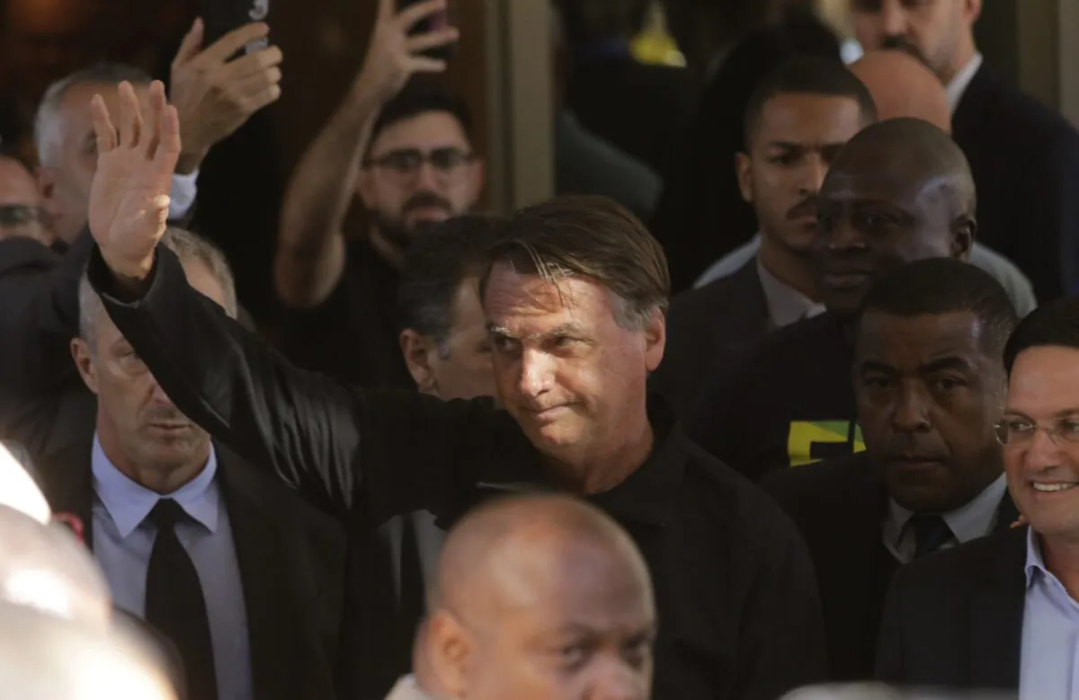 Brazil's former President Jair Bolsonaro greets supporters outside the Liberal Party's headquarters in Brasilia, Brazil, on March 30, 2023. (Gustavo Moreno/AP Photo)
