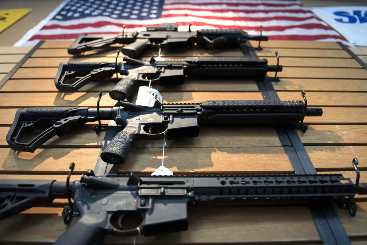 So-called “assault rifles” hang on the wall for sale at Blue Ridge Arsenal in Chantilly, Va., on Oct. 6, 2017. (Jim Watson/AFP via Getty Images)