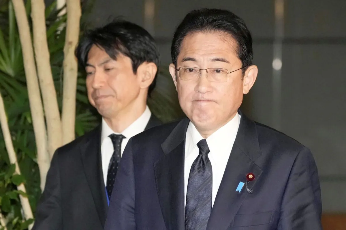 Japan's Prime Minister Fumio Kishida, (R), meets reporters after an army helicopter went missing, at his official residence in Tokyo on April 6, 2023. (Kyodo News via AP)