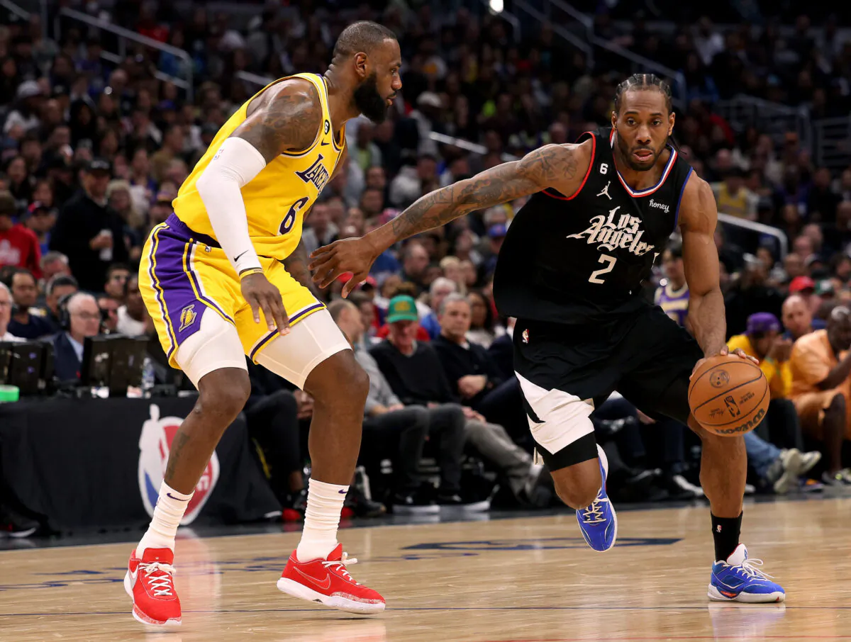 Kawhi Leonard (2) of the LA Clippers drives to the basket in front of LeBron James (6) of the Los Angeles Lakers at Crypto.com Arena in Los Angeles on April 5, 2023. (Harry How/Getty Images)