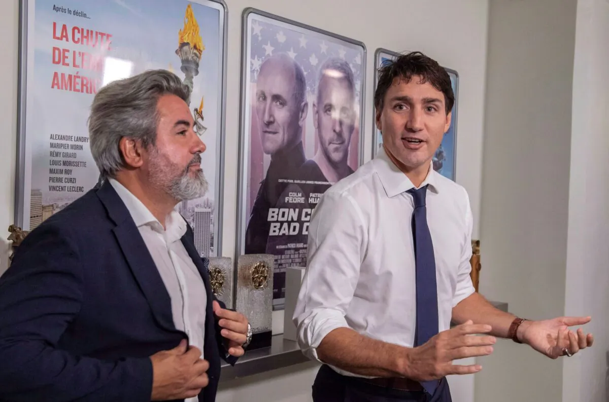 Prime Minister Justin Trudeau and Minister of Canadian Heritage Pablo Rodriguez tour a film production company in Montreal on Oct. 4, 2018. (The Canadian Press/Paul Chiasson)