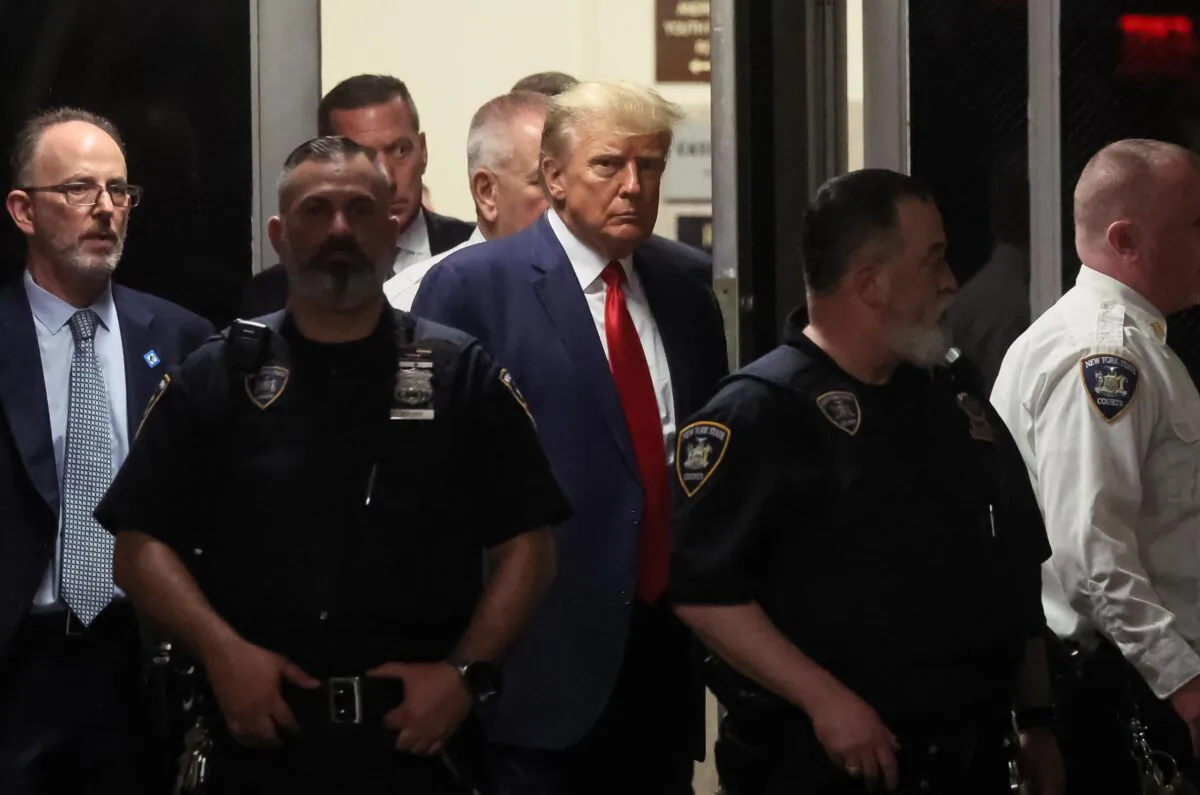 Former U.S. President Donald Trump arrives at Manhattan Criminal Courthouse, after his indictment by a Manhattan grand jury, April 4, 2023. REUTERS/Brendan McDermid