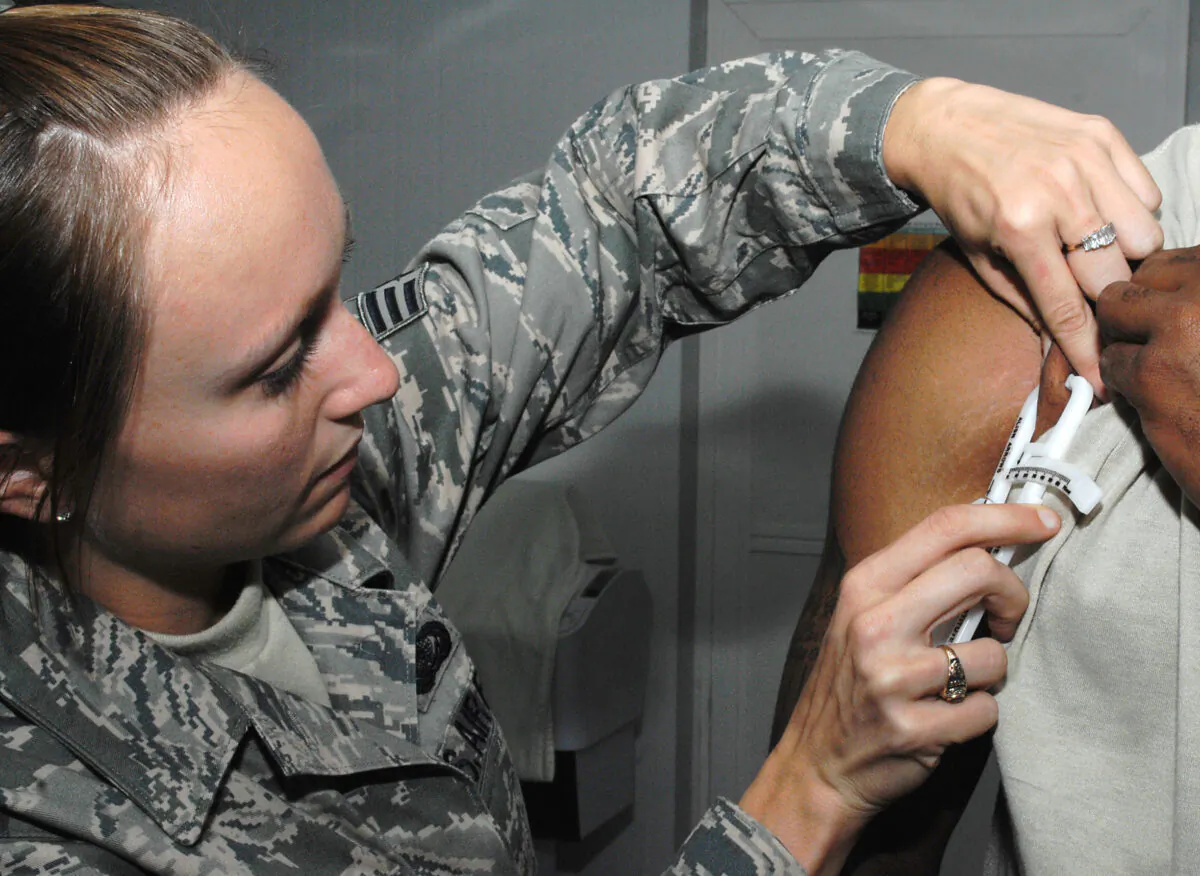 Senior Airman Jessica Mead, 407th Expeditionary Force Support Squadron personal trainer, takes a body fat measurement using calipers in a file image. (Air Force Tech. Sgt. Francesca Popp via The Epoch Times)