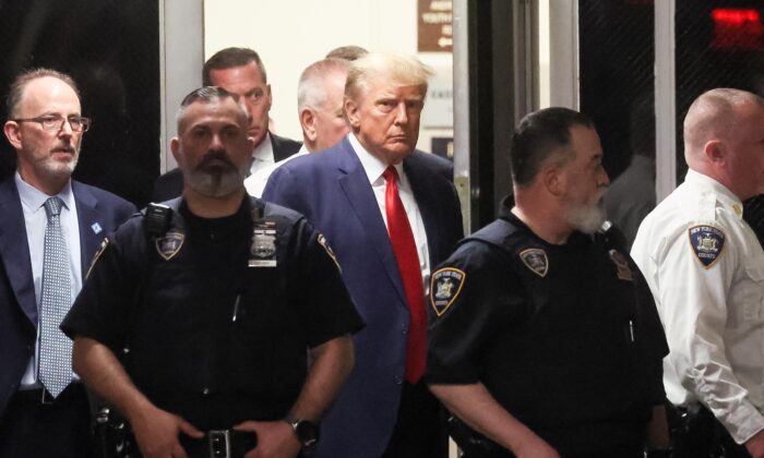 Former President Donald Trump arrives at Manhattan Criminal Courthouse on April 4, 2023. (Brendan McDermid/Reuters)